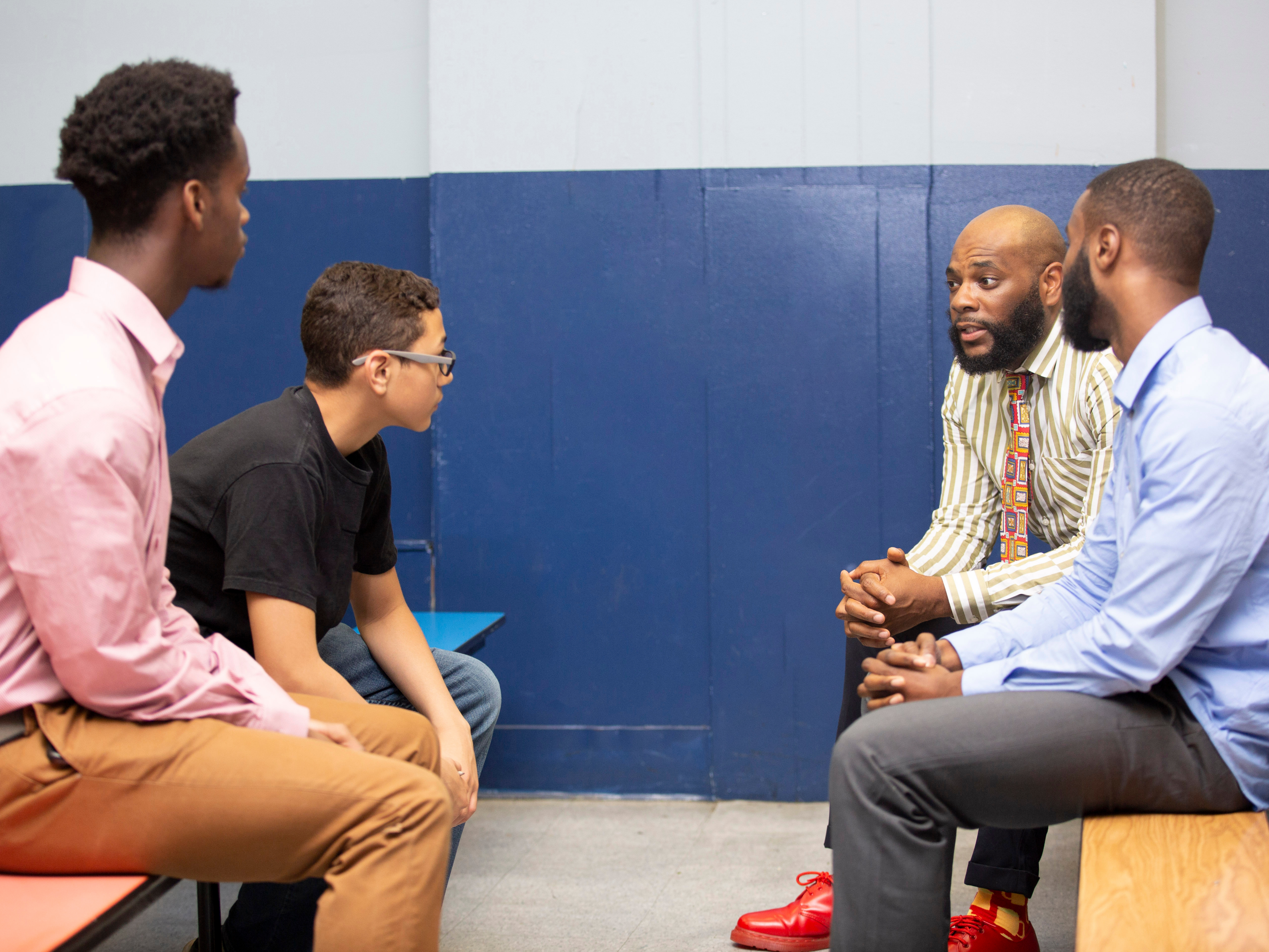 Mentorship conversation between community leaders and young professionals